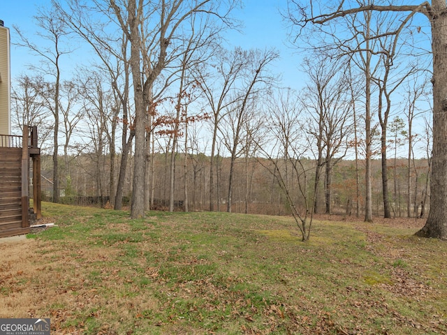 17 Rocky Mountain Pass, Adairsville, GA 30103 - view of green lawn featuring a forest view and stairs