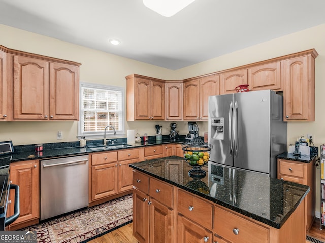 17 Rocky Mountain Pass, Adairsville, GA 30103 - kitchen with stainless steel appliances, dark stone counters, light wood-type flooring, a kitchen island, and recessed lighting