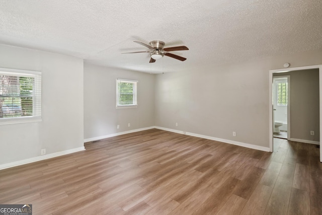 6770 Burkhead Dr, Union City, GA 30291 - unfurnished room with ceiling fan, a textured ceiling, and light wood-style floors