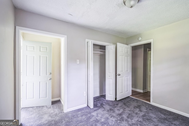 6770 Burkhead Dr, Union City, GA 30291 - unfurnished bedroom featuring carpet floors, a closet, and a textured ceiling