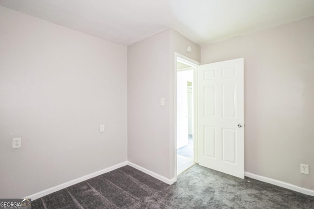 6770 Burkhead Dr, Union City, GA 30291 - unfurnished room with dark carpet and baseboards