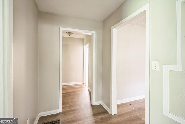6770 Burkhead Dr, Union City, GA 30291 - hall with wood finished floors and baseboards