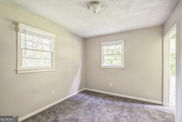 6770 Burkhead Dr, Union City, GA 30291 - empty room with carpet and a textured ceiling