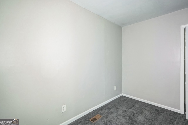 6770 Burkhead Dr, Union City, GA 30291 - spare room with dark colored carpet and baseboards