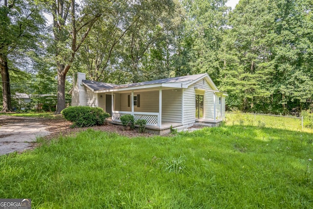 6770 Burkhead Dr, Union City, GA 30291 - view of front of house featuring a porch, a chimney, and driveway