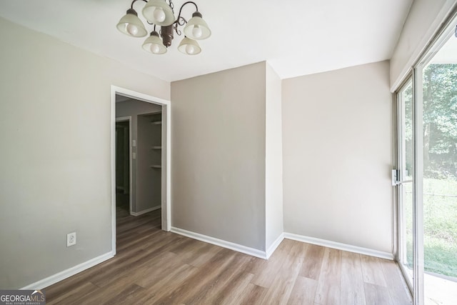 6770 Burkhead Dr, Union City, GA 30291 - unfurnished dining area featuring a chandelier and wood finished floors