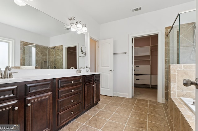 416 Fairway Dr, Acworth, GA 30101 - bathroom with a stall shower, double vanity, tile patterned flooring, a spacious closet, and tiled tub