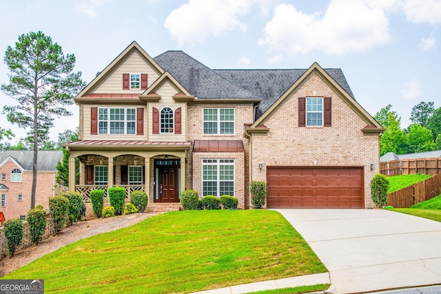 4311 Hampton Mill Pkwy, Douglasville, GA 30135 - view of front of property featuring a standing seam roof, a porch, a garage, driveway, and brick siding