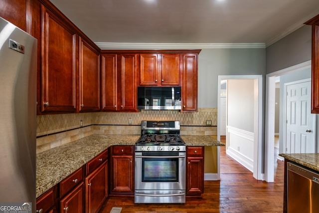 4311 Hampton Mill Pkwy, Douglasville, GA 30135 - kitchen with appliances with stainless steel finishes, dark brown cabinets, dark wood-type flooring, backsplash, and crown molding