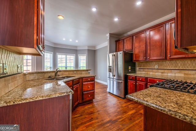 4311 Hampton Mill Pkwy, Douglasville, GA 30135 - kitchen featuring stainless steel fridge with ice dispenser, dark brown cabinets, ornamental molding, backsplash, and dark wood-style flooring