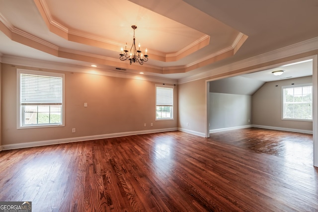 4311 Hampton Mill Pkwy, Douglasville, GA 30135 - spare room featuring a tray ceiling, a chandelier, ornamental molding, and dark wood-style flooring