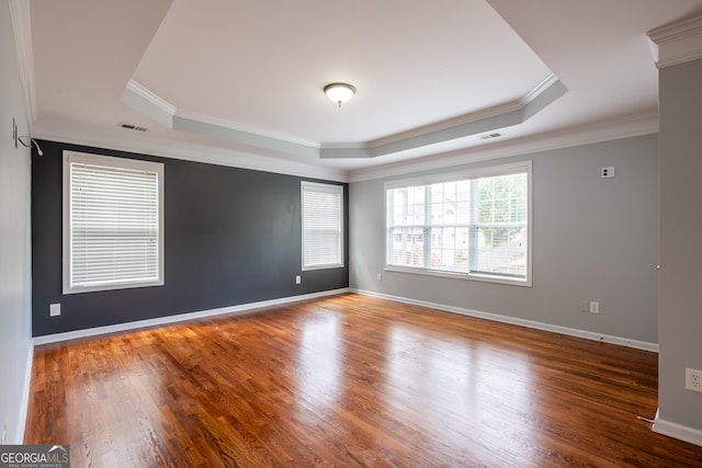 4311 Hampton Mill Pkwy, Douglasville, GA 30135 - unfurnished room with a tray ceiling, crown molding, and wood finished floors