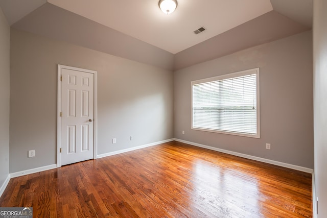 4311 Hampton Mill Pkwy, Douglasville, GA 30135 - spare room featuring vaulted ceiling and wood finished floors