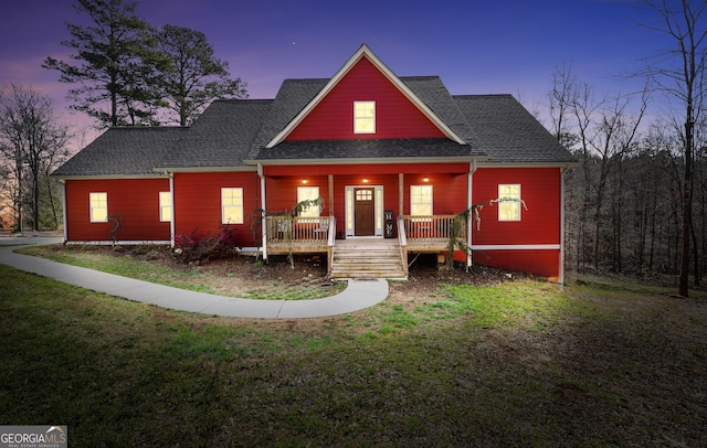 230 Thorpe Rd, Jackson, GA 30233 - view of front of property with a porch, a front lawn, and roof with shingles