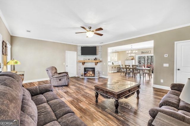 230 Thorpe Rd, Jackson, GA 30233 - living area featuring ceiling fan, a brick fireplace, wood finished floors, and ornamental molding