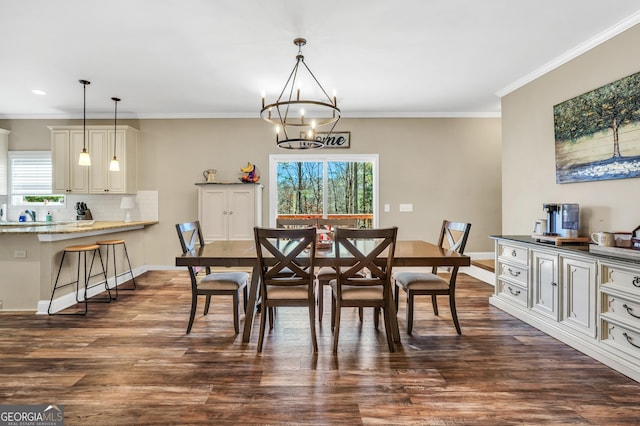 230 Thorpe Rd, Jackson, GA 30233 - dining room featuring healthy amount of natural light, a chandelier, dark wood-style flooring, ornamental molding, and recessed lighting