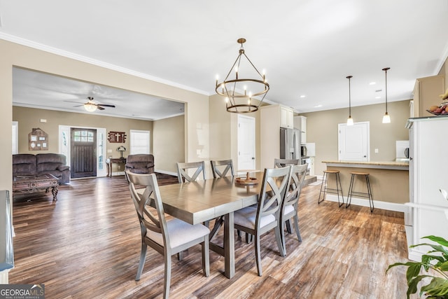 230 Thorpe Rd, Jackson, GA 30233 - dining space featuring wood finished floors, a chandelier, recessed lighting, crown molding, and a ceiling fan
