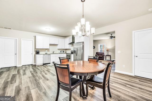230 Thorpe Rd, Jackson, GA 30233 - dining room featuring a chandelier, light wood-type flooring, and ceiling fan