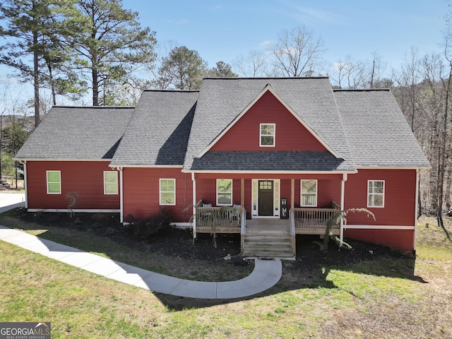 230 Thorpe Rd, Jackson, GA 30233 - view of front of property with covered porch, a front lawn, and roof with shingles