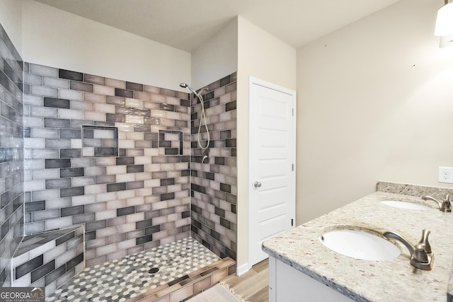 230 Thorpe Rd, Jackson, GA 30233 - bathroom with tiled shower, double vanity, and wood finished floors