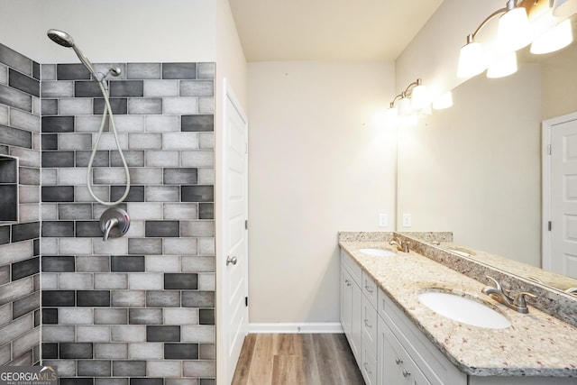 230 Thorpe Rd, Jackson, GA 30233 - bathroom with double vanity, wood finished floors, and a tile shower