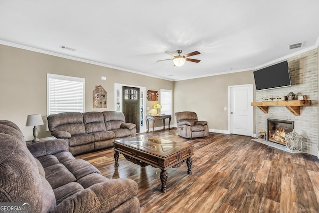 230 Thorpe Rd, Jackson, GA 30233 - living area with wood finished floors, crown molding, ceiling fan, and a fireplace