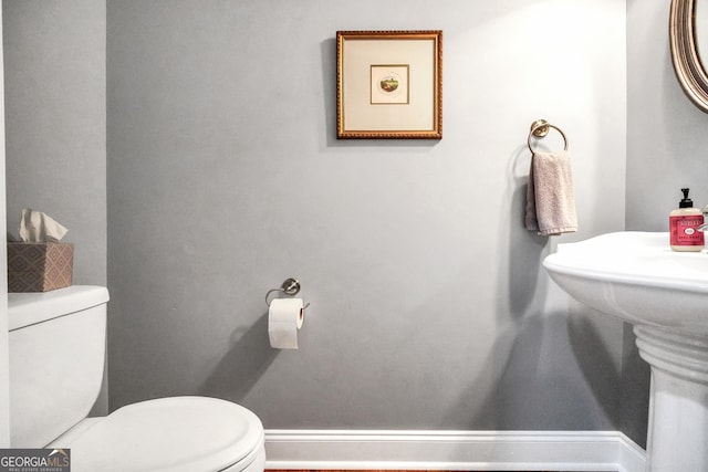 204 Carmell Ct, Mcdonough, GA 30252 - half bathroom featuring toilet and baseboards