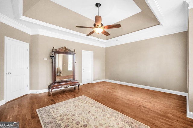 204 Carmell Ct, Mcdonough, GA 30252 - empty room with a raised ceiling, ceiling fan, wood finished floors, and ornamental molding
