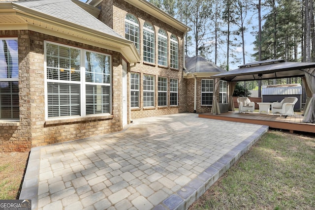 204 Carmell Ct, Mcdonough, GA 30252 - view of patio with a gazebo, a deck, and a hot tub