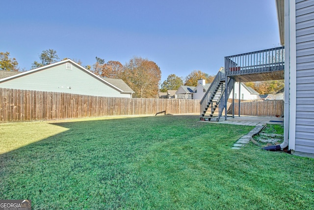 18 Marco Ct, Newnan, GA 30265 - fenced backyard with stairs and a wooden deck