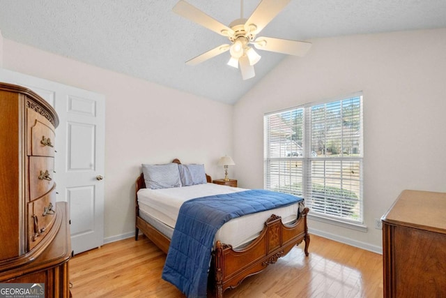 3076 Harris Mill Ct, Duluth, GA 30096 - bedroom featuring light wood finished floors, lofted ceiling, and ceiling fan