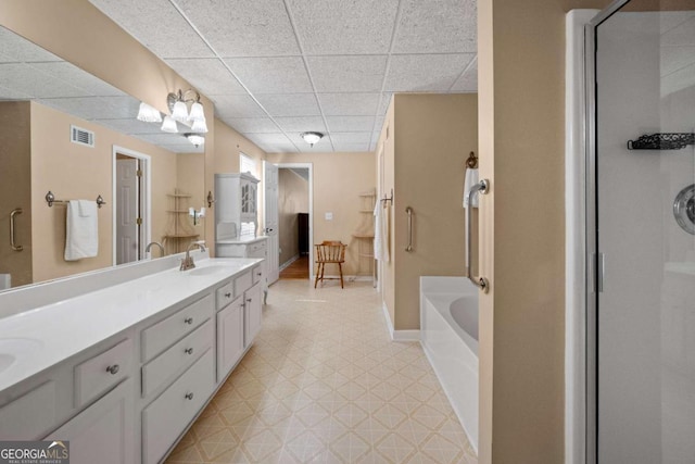3076 Harris Mill Ct, Duluth, GA 30096 - full bath featuring tile patterned floors, a garden tub, double vanity, a drop ceiling, and a stall shower
