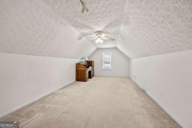 3076 Harris Mill Ct, Duluth, GA 30096 - bonus room featuring carpet, ceiling fan, vaulted ceiling, and a textured ceiling