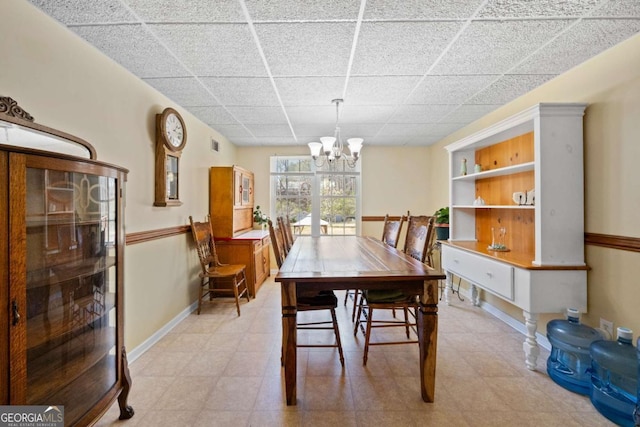 3076 Harris Mill Ct, Duluth, GA 30096 - dining space featuring a paneled ceiling and a chandelier
