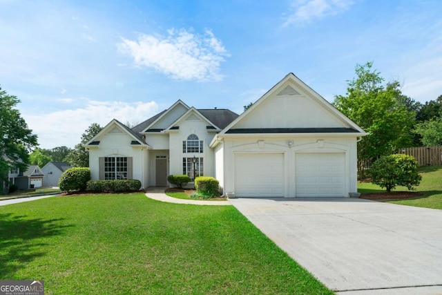 3047 Standing Rock Ct, Lithia Springs, GA 30122 - view of front facade with stucco siding, an attached garage, and driveway