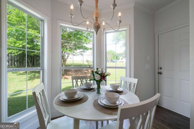3047 Standing Rock Ct, Lithia Springs, GA 30122 - dining space with a chandelier, ornamental molding, and wood finished floors