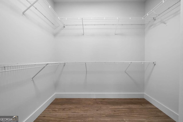 3047 Standing Rock Ct, Lithia Springs, GA 30122 - walk in closet featuring dark wood finished floors