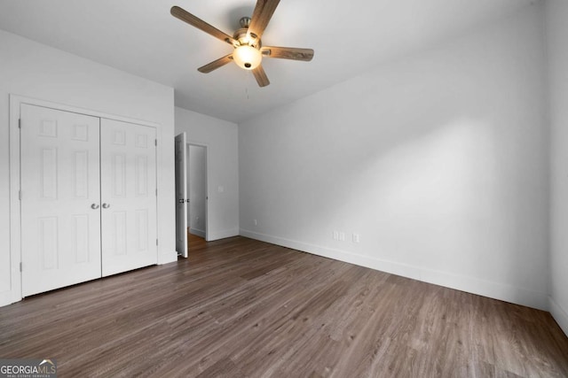 3047 Standing Rock Ct, Lithia Springs, GA 30122 - unfurnished bedroom with a closet, wood finished floors, and ceiling fan