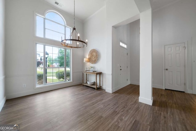 3047 Standing Rock Ct, Lithia Springs, GA 30122 - foyer entrance with a towering ceiling, a chandelier, and wood finished floors