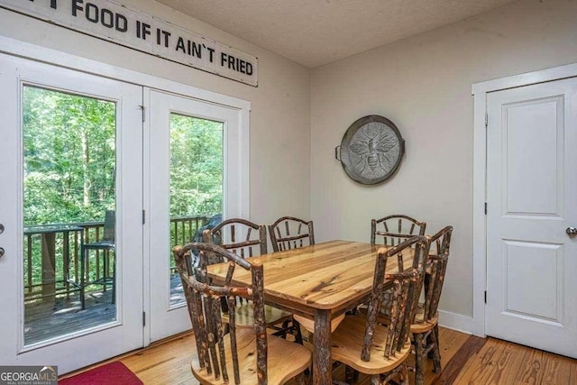 104 Buck Run E, Dahlonega, GA 30533 - dining space with light wood finished floors and a textured ceiling