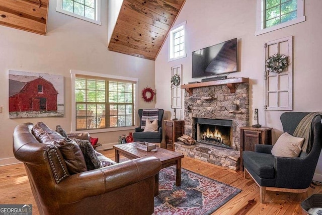104 Buck Run E, Dahlonega, GA 30533 - living area with high vaulted ceiling, wood-type flooring, a fireplace, and wood ceiling