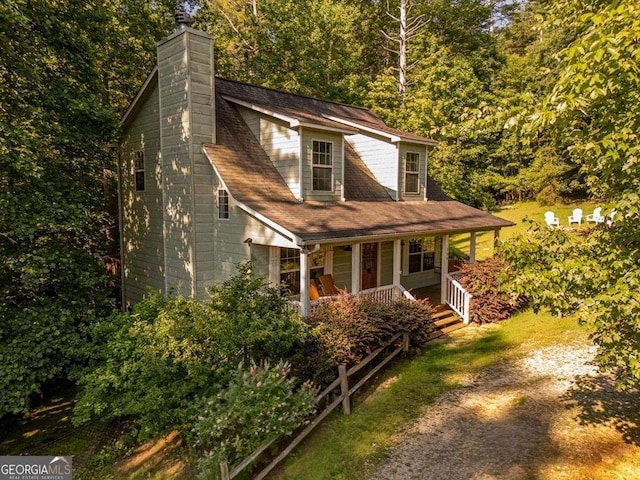 104 Buck Run E, Dahlonega, GA 30533 - view of front facade with a porch, a chimney, and a forest view