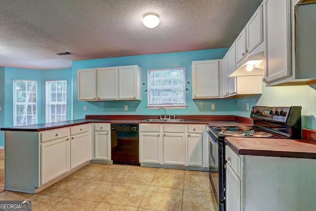 1067 Misty Meadows Pt, Hampton, GA 30228 - kitchen with black appliances, a peninsula, under cabinet range hood, dark countertops, and a textured ceiling
