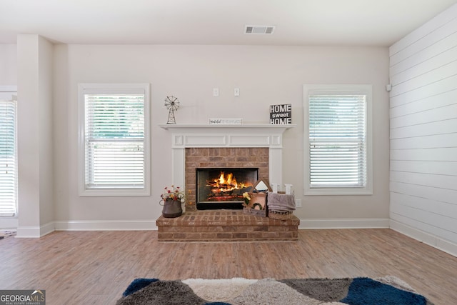 470 Louise Way, Locust Grove, GA 30248 - living room featuring wood finished floors and a brick fireplace