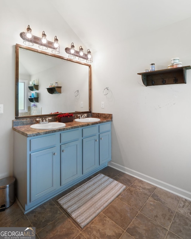 470 Louise Way, Locust Grove, GA 30248 - bathroom featuring double vanity and vaulted ceiling