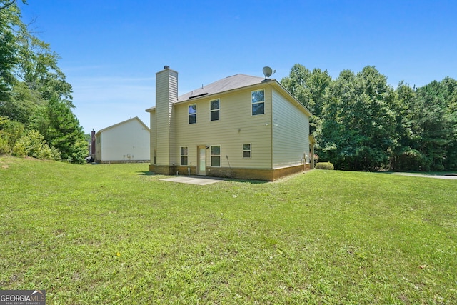 470 Louise Way, Locust Grove, GA 30248 - rear view of property with a chimney, a yard, and a patio area