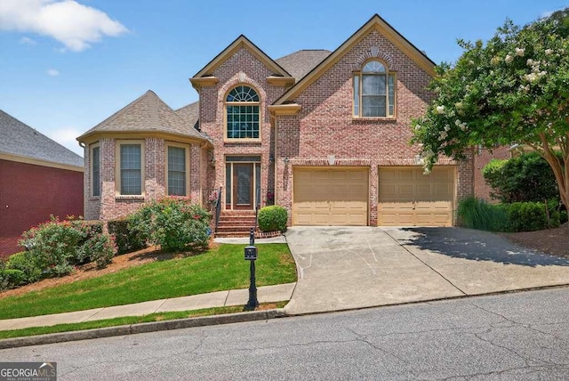 2002 Ivy Ridge Rd SE, Smyrna, GA 30080 - traditional-style house featuring brick siding, concrete driveway, and a garage