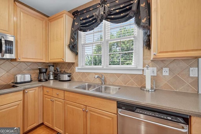 2002 Ivy Ridge Rd SE, Smyrna, GA 30080 - kitchen with appliances with stainless steel finishes, light brown cabinets, tasteful backsplash, and light countertops