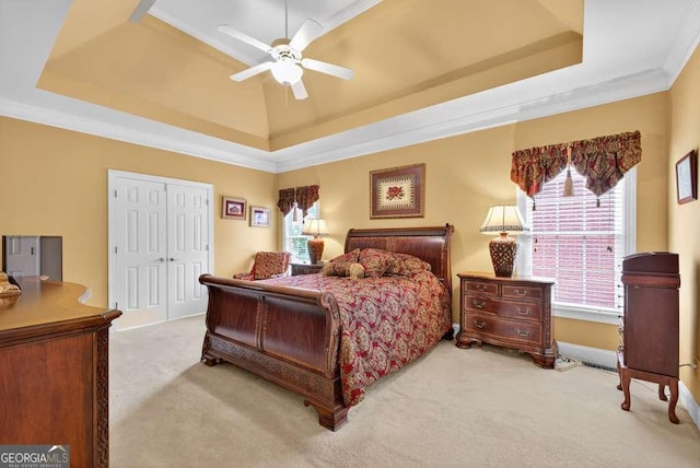 2002 Ivy Ridge Rd SE, Smyrna, GA 30080 - bedroom featuring a raised ceiling, carpet floors, a closet, and crown molding