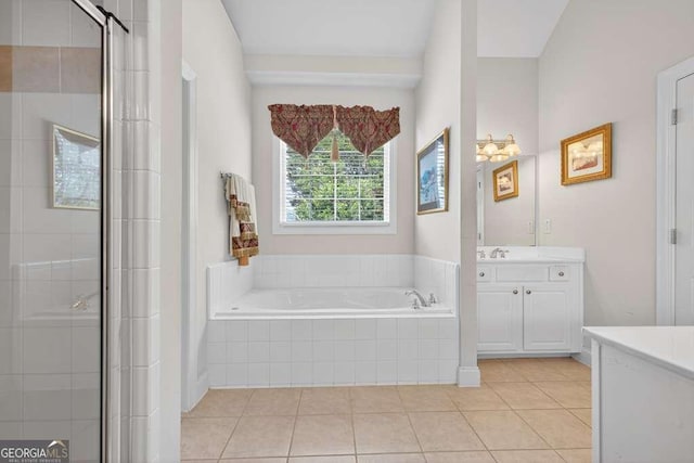 2002 Ivy Ridge Rd SE, Smyrna, GA 30080 - bathroom with vanity, a bath, tile patterned floors, and a shower stall
